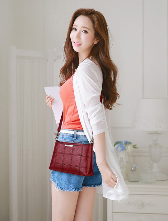 Clutched splicing soft leather crossbody bag