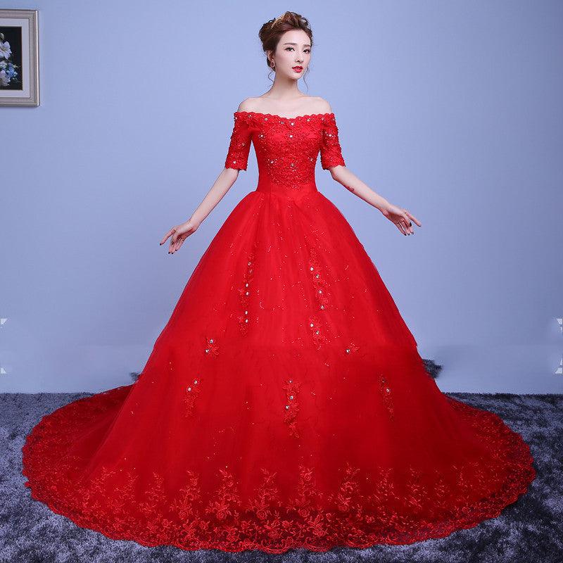 Red trailing one-shoulder wedding dress