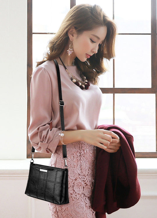 Clutched splicing soft leather crossbody bag