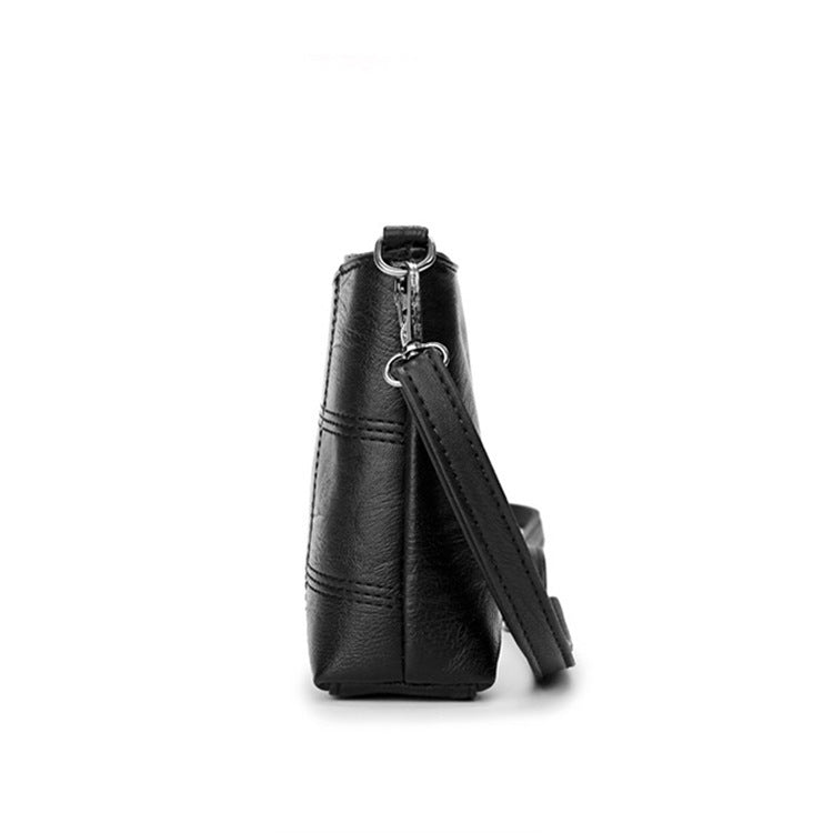Clutched splicing soft leather crossbody bag