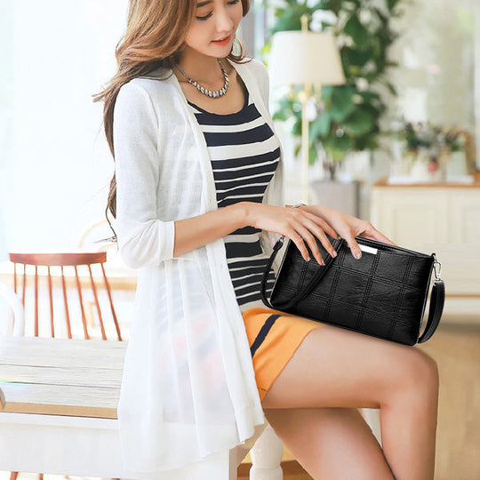Clutched splicing soft leather crossbody bag