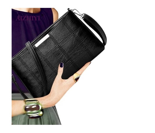 Clutched splicing soft leather crossbody bag